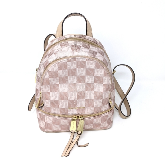 Michael Kors Handbags - 🚨 Sale! 🎉Michael Kors Rose Gold Checkerboard XS Backpack Rare!
